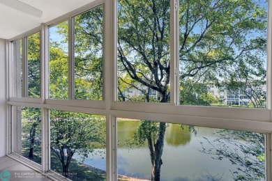 Move right into this tropical paradise of Wynmoor Village! Fully on Wynmoor Golf Course in Florida - for sale on GolfHomes.com, golf home, golf lot