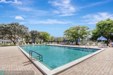 Move right into this tropical paradise of Wynmoor Village! Fully on Wynmoor Golf Course in Florida - for sale on GolfHomes.com, golf home, golf lot