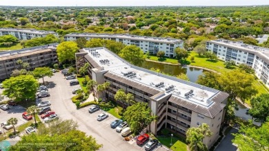 Move right into this tropical paradise of Wynmoor Village! Fully on Wynmoor Golf Course in Florida - for sale on GolfHomes.com, golf home, golf lot