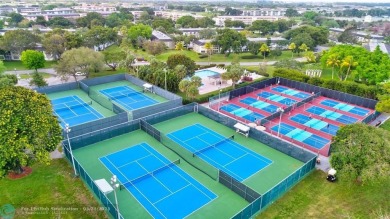 Move right into this tropical paradise of Wynmoor Village! Fully on Wynmoor Golf Course in Florida - for sale on GolfHomes.com, golf home, golf lot