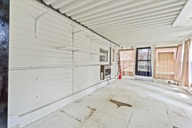 Take a look at this camper with a sunroom located in Holiday Out on Lake Tansi Village Country Club in Tennessee - for sale on GolfHomes.com, golf home, golf lot