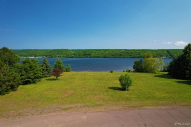 A rare opportunity to own Portage Lake waterfront property in on Portage Lake Golf Course in Michigan - for sale on GolfHomes.com, golf home, golf lot