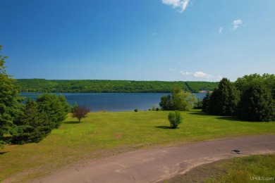 A rare opportunity to own Portage Lake waterfront property in on Portage Lake Golf Course in Michigan - for sale on GolfHomes.com, golf home, golf lot