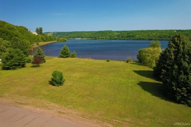 A rare opportunity to own Portage Lake waterfront property in on Portage Lake Golf Course in Michigan - for sale on GolfHomes.com, golf home, golf lot