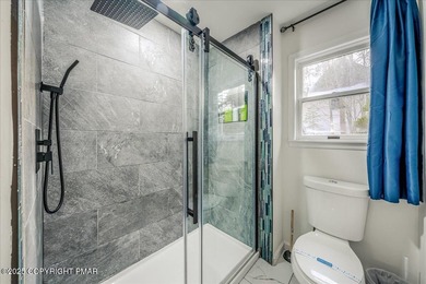 Do not miss this turnkey, fully furnished, and STR-ready in on Pocono Farms Country Club in Pennsylvania - for sale on GolfHomes.com, golf home, golf lot