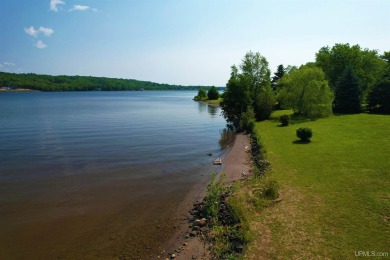 A rare opportunity to own Portage Lake waterfront property in on Portage Lake Golf Course in Michigan - for sale on GolfHomes.com, golf home, golf lot