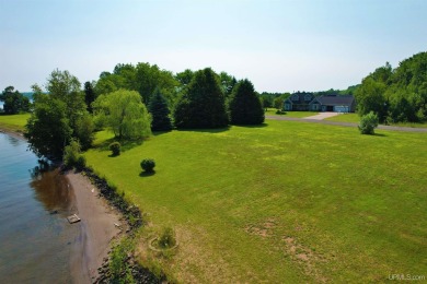 A rare opportunity to own Portage Lake waterfront property in on Portage Lake Golf Course in Michigan - for sale on GolfHomes.com, golf home, golf lot