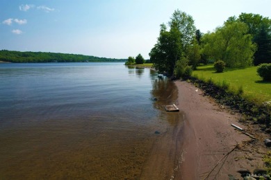 A rare opportunity to own Portage Lake waterfront property in on Portage Lake Golf Course in Michigan - for sale on GolfHomes.com, golf home, golf lot