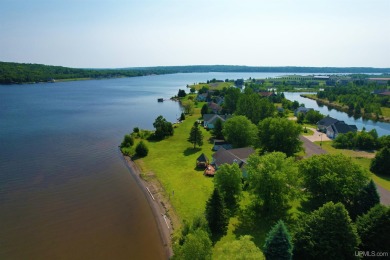 A rare opportunity to own Portage Lake waterfront property in on Portage Lake Golf Course in Michigan - for sale on GolfHomes.com, golf home, golf lot