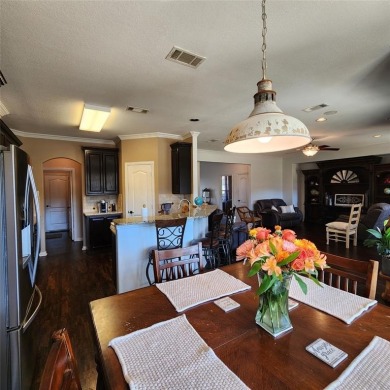 Immaculate riverfront home with a gradual slope yard to the on Pecan Plantation Country Club in Texas - for sale on GolfHomes.com, golf home, golf lot
