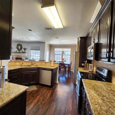 Immaculate riverfront home with a gradual slope yard to the on Pecan Plantation Country Club in Texas - for sale on GolfHomes.com, golf home, golf lot
