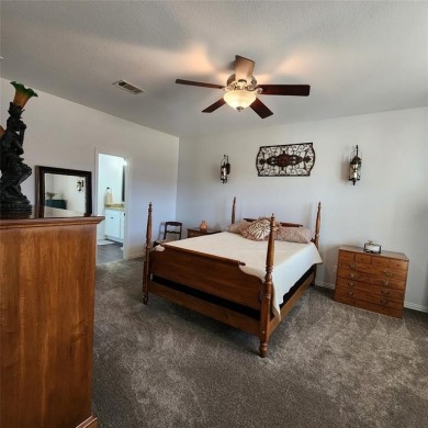 Immaculate riverfront home with a gradual slope yard to the on Pecan Plantation Country Club in Texas - for sale on GolfHomes.com, golf home, golf lot