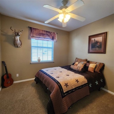 Immaculate riverfront home with a gradual slope yard to the on Pecan Plantation Country Club in Texas - for sale on GolfHomes.com, golf home, golf lot