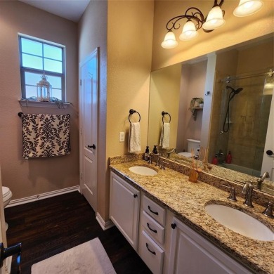 Immaculate riverfront home with a gradual slope yard to the on Pecan Plantation Country Club in Texas - for sale on GolfHomes.com, golf home, golf lot