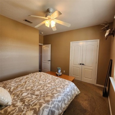 Immaculate riverfront home with a gradual slope yard to the on Pecan Plantation Country Club in Texas - for sale on GolfHomes.com, golf home, golf lot