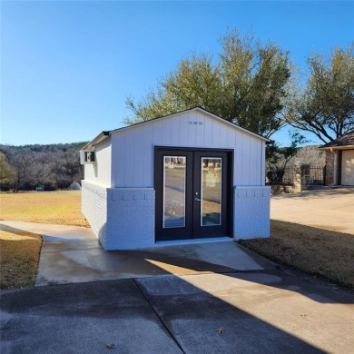Immaculate riverfront home with a gradual slope yard to the on Pecan Plantation Country Club in Texas - for sale on GolfHomes.com, golf home, golf lot