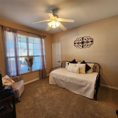 Immaculate riverfront home with a gradual slope yard to the on Pecan Plantation Country Club in Texas - for sale on GolfHomes.com, golf home, golf lot