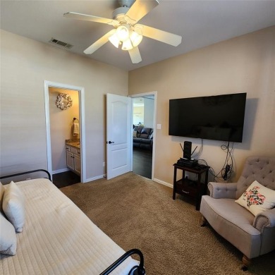 Immaculate riverfront home with a gradual slope yard to the on Pecan Plantation Country Club in Texas - for sale on GolfHomes.com, golf home, golf lot