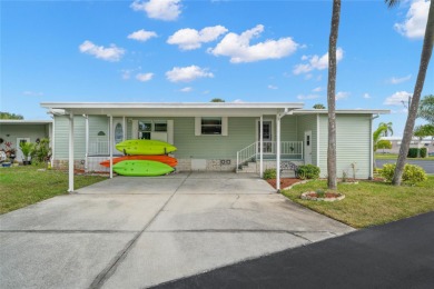 Fall in love with this well-maintained 2 bed/2 bath 1997 home on Mangrove Bay Golf Course in Florida - for sale on GolfHomes.com, golf home, golf lot