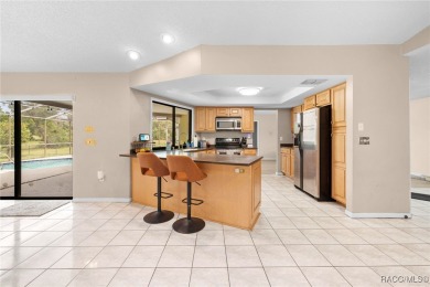 Welcome to this stunning 3-bedroom, 2-bathroom pool home on Oak Hills Country Club in Florida - for sale on GolfHomes.com, golf home, golf lot