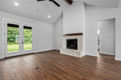 Welcome to East Village! This thoughtfully designed 3-bedroom, 2 on Vache-Grasse Country Club in Arkansas - for sale on GolfHomes.com, golf home, golf lot