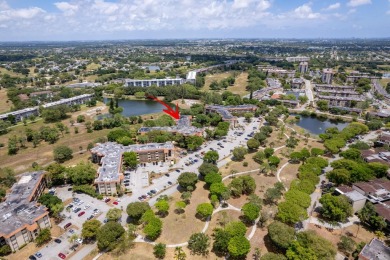 GORGEOUS & PRISTINE WATERFRONT CONDO! PRESTIGIOUS THE FALLS OF on Inverrary Country Club in Florida - for sale on GolfHomes.com, golf home, golf lot