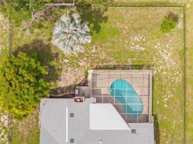 Welcome to this stunning 3-bedroom, 2-bathroom pool home on Oak Hills Country Club in Florida - for sale on GolfHomes.com, golf home, golf lot