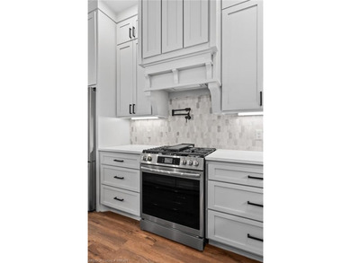 Welcome to East Village! This thoughtfully designed 3-bedroom, 2 on Vache-Grasse Country Club in Arkansas - for sale on GolfHomes.com, golf home, golf lot