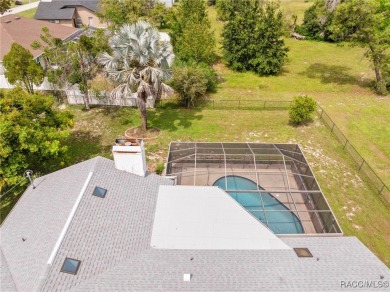 Welcome to this stunning 3-bedroom, 2-bathroom pool home on Oak Hills Country Club in Florida - for sale on GolfHomes.com, golf home, golf lot