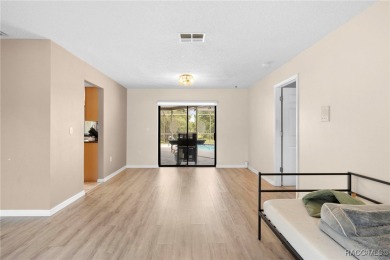 Welcome to this stunning 3-bedroom, 2-bathroom pool home on Oak Hills Country Club in Florida - for sale on GolfHomes.com, golf home, golf lot