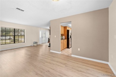 Welcome to this stunning 3-bedroom, 2-bathroom pool home on Oak Hills Country Club in Florida - for sale on GolfHomes.com, golf home, golf lot