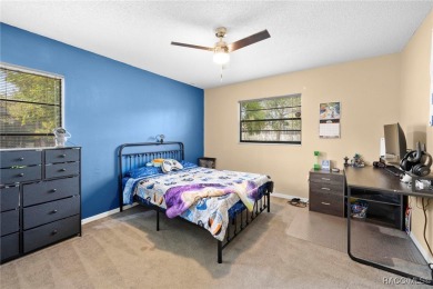 Welcome to this stunning 3-bedroom, 2-bathroom pool home on Oak Hills Country Club in Florida - for sale on GolfHomes.com, golf home, golf lot