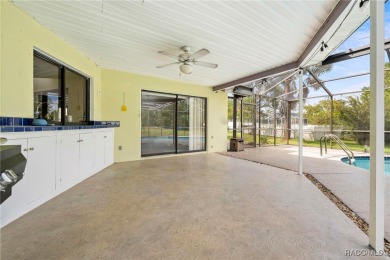 Welcome to this stunning 3-bedroom, 2-bathroom pool home on Oak Hills Country Club in Florida - for sale on GolfHomes.com, golf home, golf lot