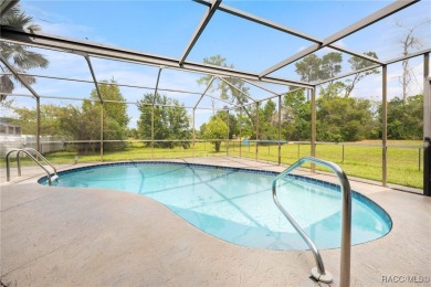 Welcome to this stunning 3-bedroom, 2-bathroom pool home on Oak Hills Country Club in Florida - for sale on GolfHomes.com, golf home, golf lot