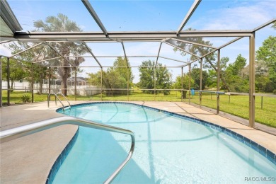 Welcome to this stunning 3-bedroom, 2-bathroom pool home on Oak Hills Country Club in Florida - for sale on GolfHomes.com, golf home, golf lot