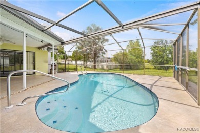 Welcome to this stunning 3-bedroom, 2-bathroom pool home on Oak Hills Country Club in Florida - for sale on GolfHomes.com, golf home, golf lot