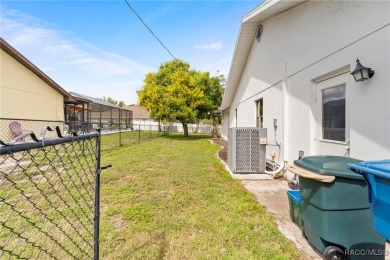 Welcome to this stunning 3-bedroom, 2-bathroom pool home on Oak Hills Country Club in Florida - for sale on GolfHomes.com, golf home, golf lot