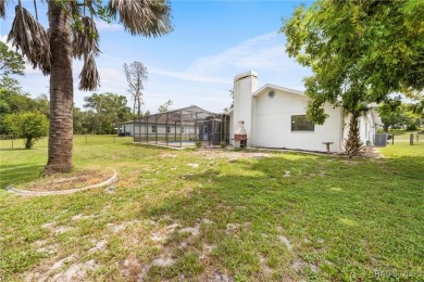 Welcome to this stunning 3-bedroom, 2-bathroom pool home on Oak Hills Country Club in Florida - for sale on GolfHomes.com, golf home, golf lot