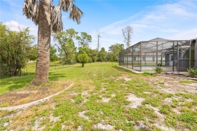 Welcome to this stunning 3-bedroom, 2-bathroom pool home on Oak Hills Country Club in Florida - for sale on GolfHomes.com, golf home, golf lot