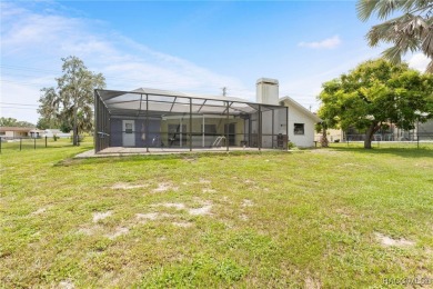 Welcome to this stunning 3-bedroom, 2-bathroom pool home on Oak Hills Country Club in Florida - for sale on GolfHomes.com, golf home, golf lot