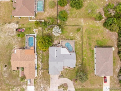 Welcome to this stunning 3-bedroom, 2-bathroom pool home on Oak Hills Country Club in Florida - for sale on GolfHomes.com, golf home, golf lot