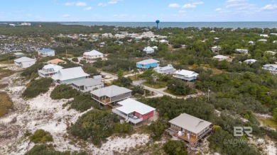 Start your morning with a coffee on the porch swing while you on Kiva Dunes Golf Club in Alabama - for sale on GolfHomes.com, golf home, golf lot