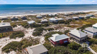 Start your morning with a coffee on the porch swing while you on Kiva Dunes Golf Club in Alabama - for sale on GolfHomes.com, golf home, golf lot