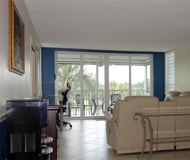 Your dream home with sweeping golf course and pond views! This on Palm-Aire Country Club and Resort - Palms in Florida - for sale on GolfHomes.com, golf home, golf lot