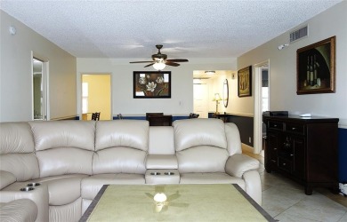 Your dream home with sweeping golf course and pond views! This on Palm-Aire Country Club and Resort - Palms in Florida - for sale on GolfHomes.com, golf home, golf lot