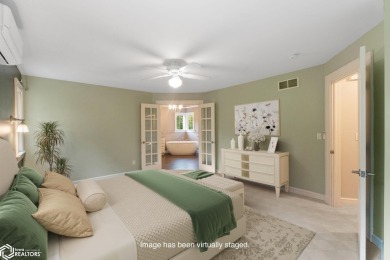 Nestled on over an acre on a scenic private drive, this on Highland Park Golf Course in Iowa - for sale on GolfHomes.com, golf home, golf lot