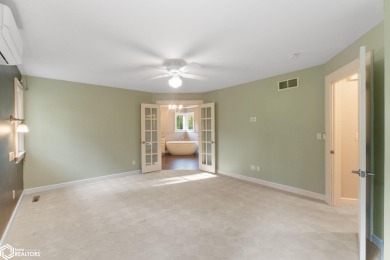 Nestled on over an acre on a scenic private drive, this on Highland Park Golf Course in Iowa - for sale on GolfHomes.com, golf home, golf lot
