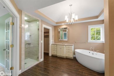 Nestled on over an acre on a scenic private drive, this on Highland Park Golf Course in Iowa - for sale on GolfHomes.com, golf home, golf lot