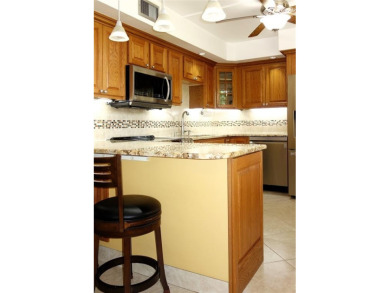 Your dream home with sweeping golf course and pond views! This on Palm-Aire Country Club and Resort - Palms in Florida - for sale on GolfHomes.com, golf home, golf lot