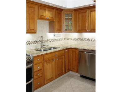 Your dream home with sweeping golf course and pond views! This on Palm-Aire Country Club and Resort - Palms in Florida - for sale on GolfHomes.com, golf home, golf lot